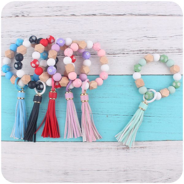 Wholesale Wooden Small Daisy Flower Leather PU Short Tassel Handmade Beaded Bracelet Keychains For Discount