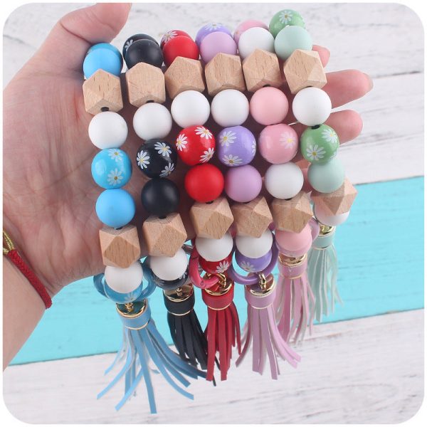 Wholesale Wooden Small Daisy Flower Leather PU Short Tassel Handmade Beaded Bracelet Keychains For Discount